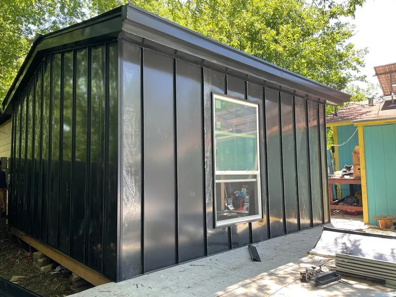 Black standing seam metal wall panels for Roof Inspection in Cloquet