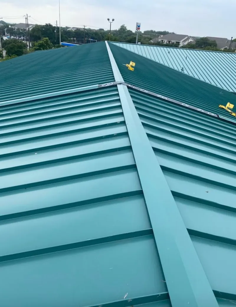 Green commercial metal roof ridge and valley for Metal Roof Repair in Cloquet